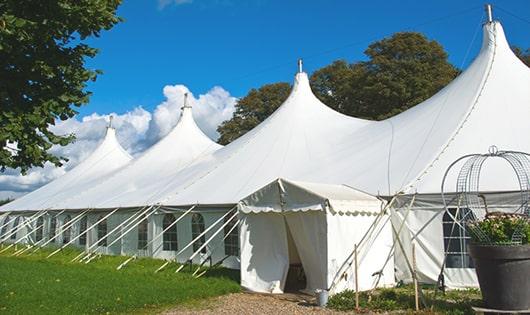 a line of sleek and modern porta potties ready for use at an upscale corporate event in Bolton